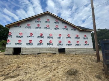 Exterior wall sheathing and house wrap installed