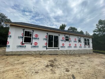 Front elevation with window and door openings framed