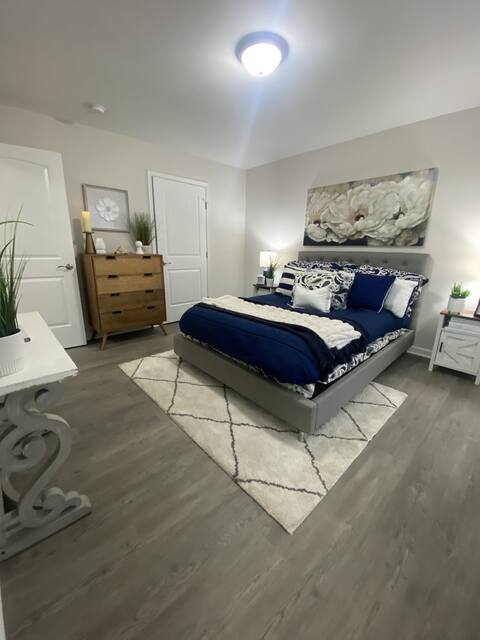 Bedroom staged with navy bedding
