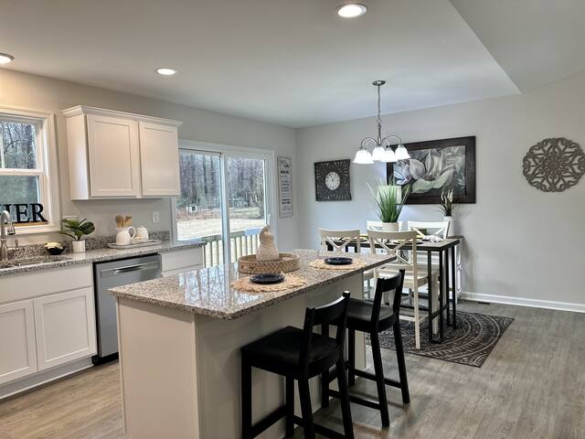 Kitchen and breakfast nook with pendant lighting
